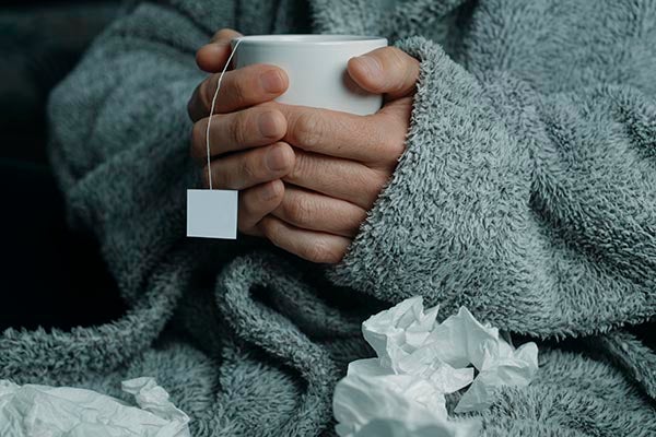 flu patient with tea