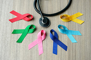 Different colored ribbons next to a stethoscope
