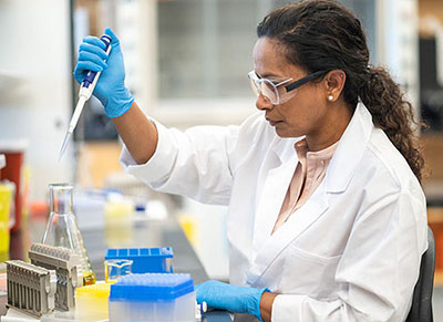 Lab employee with tubes