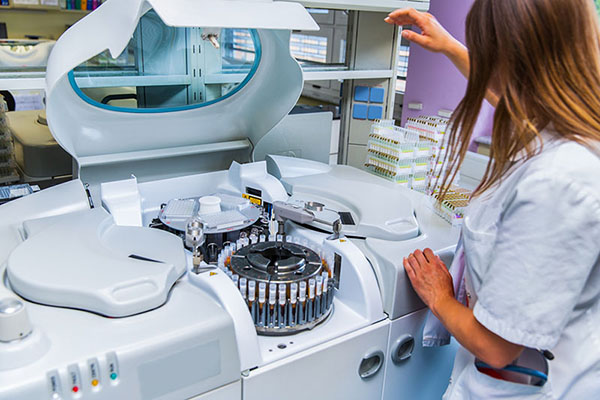 lab tech with centrifuge